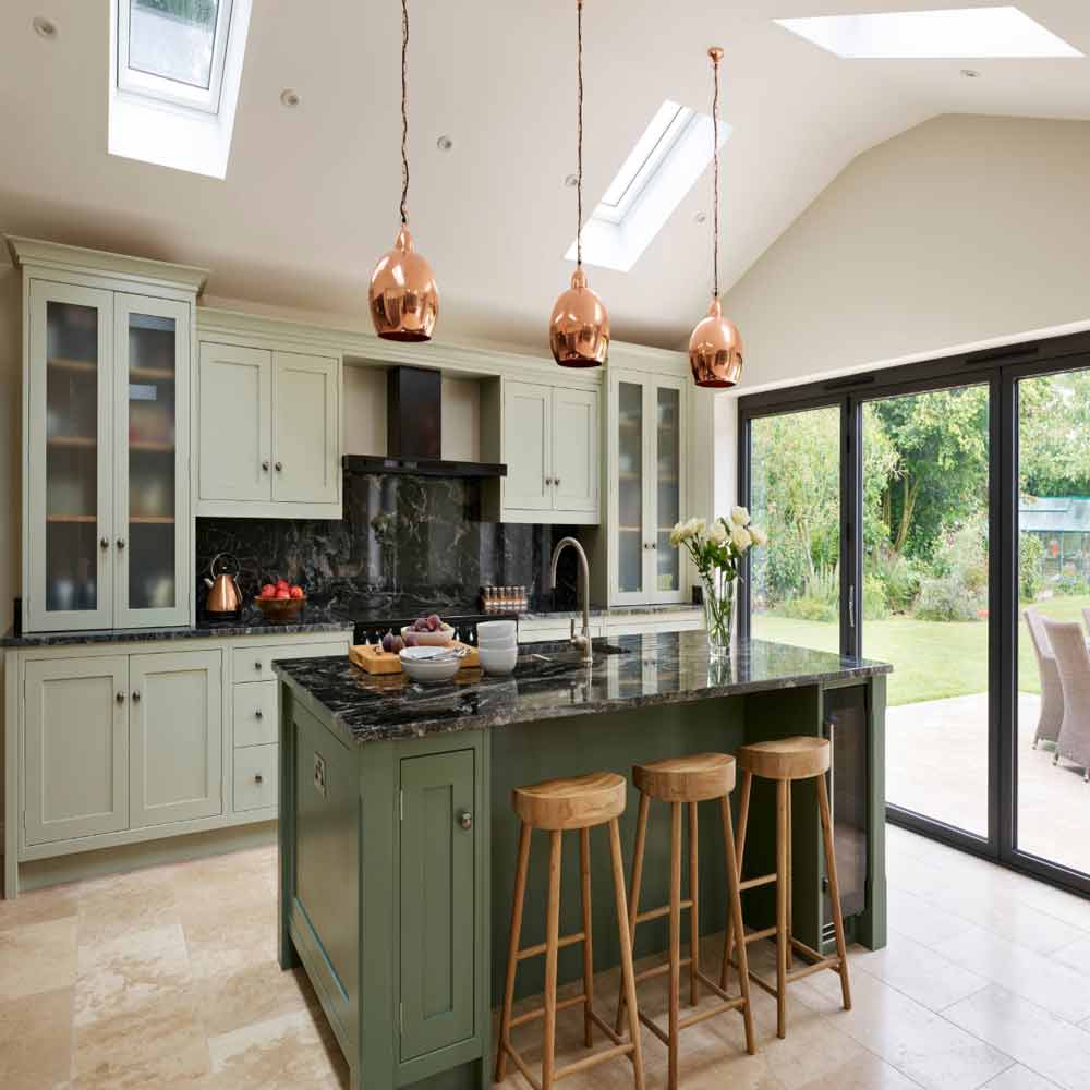 a small nice planned modular kitchen with island and imported granite countertop manufactured in gurgaon and delhi