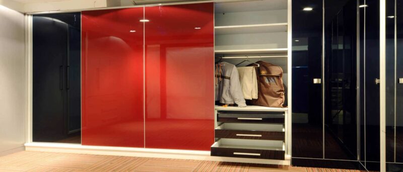lacquer glass wardrobe in red colour by the design indian wardrobe company